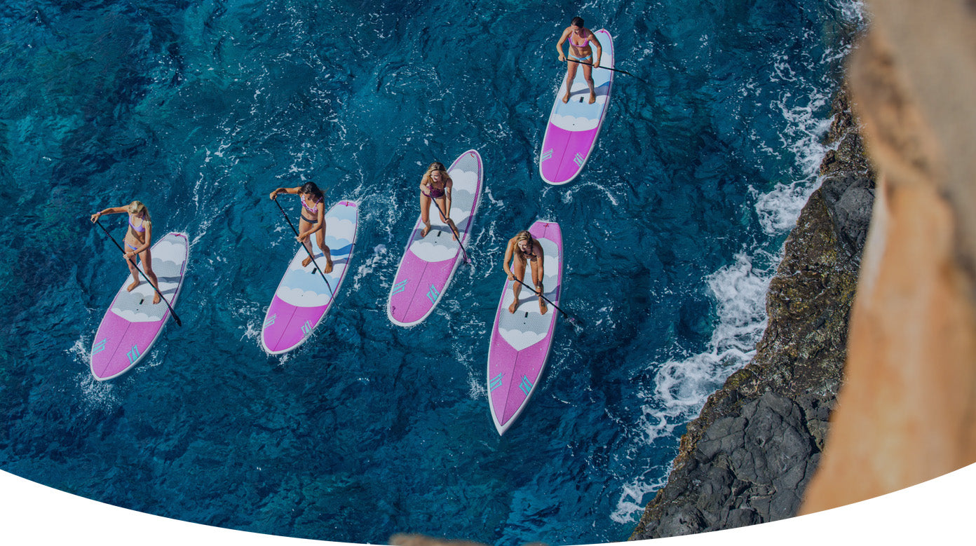 People paddleboarding on the ocean